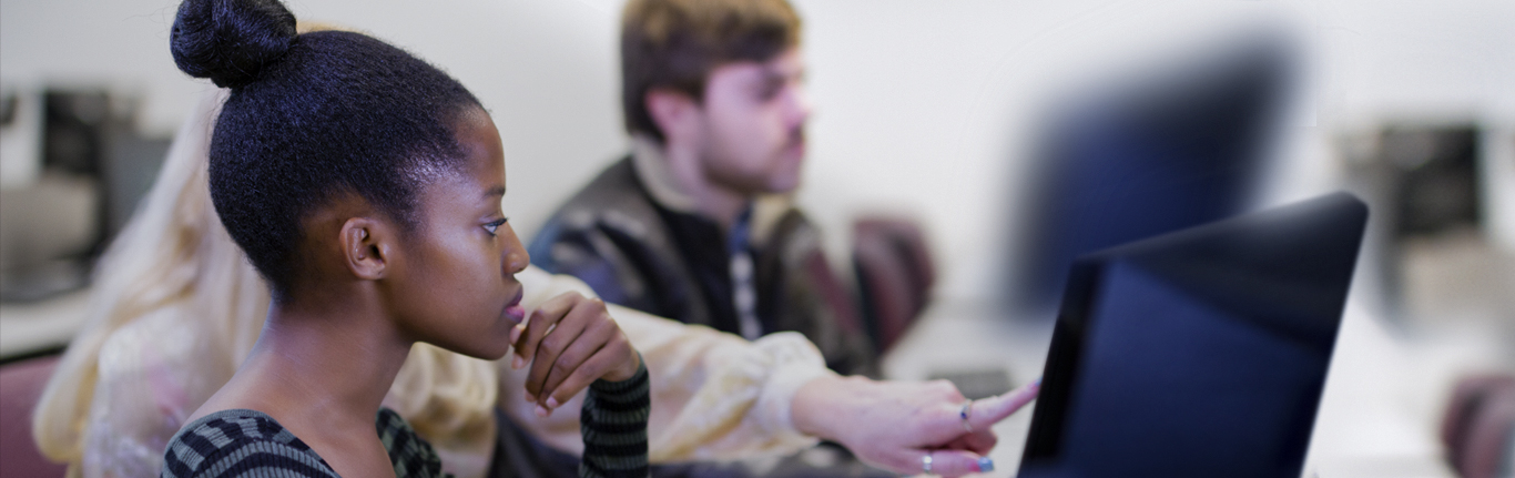 CAWT students with instructor on computers. 