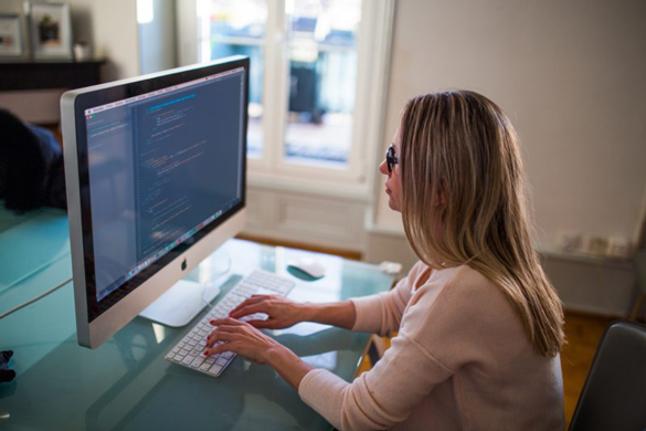 Website Designer working on computer.