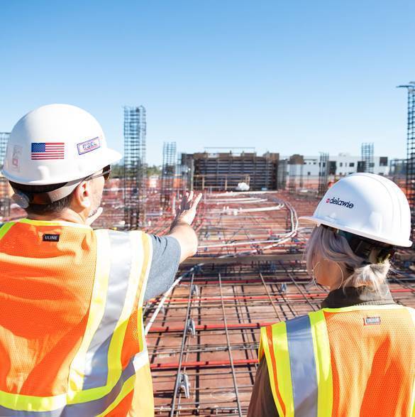 Construction workers on a contruction site.
