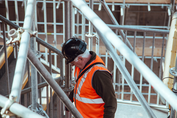 Building inspector looking at piping.
