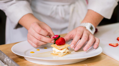 Student chef preparing dessert. 