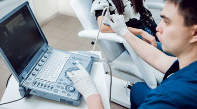 Patient with Sonographer in his office.