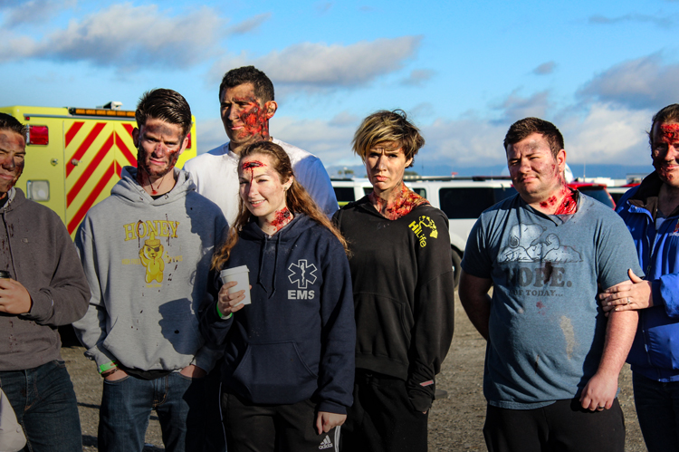 EMT students practicing an injury scene.