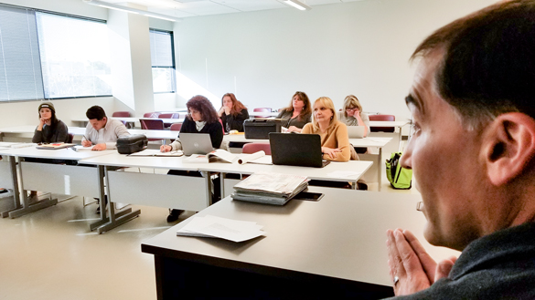 Interior Design instructor teaching in classroom. 