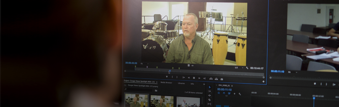 New Media Journalism student in video editing software. 