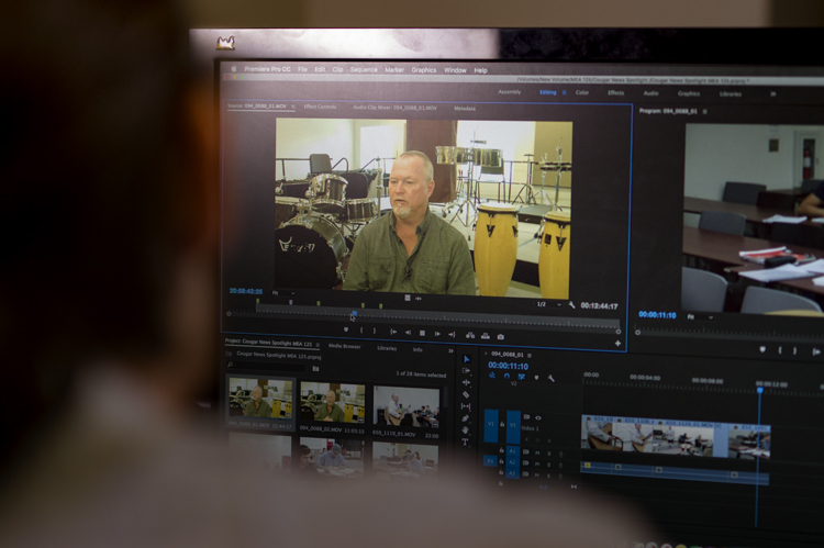 New Media Journalism student in video editing software. 