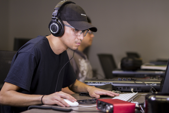 Media Entertainment Arts student working on film/video editing project. 