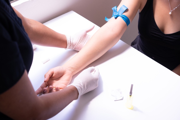 Preparing an arm for Phlebotomy. 