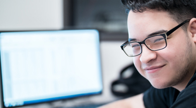 Computer Networking student at computer. 