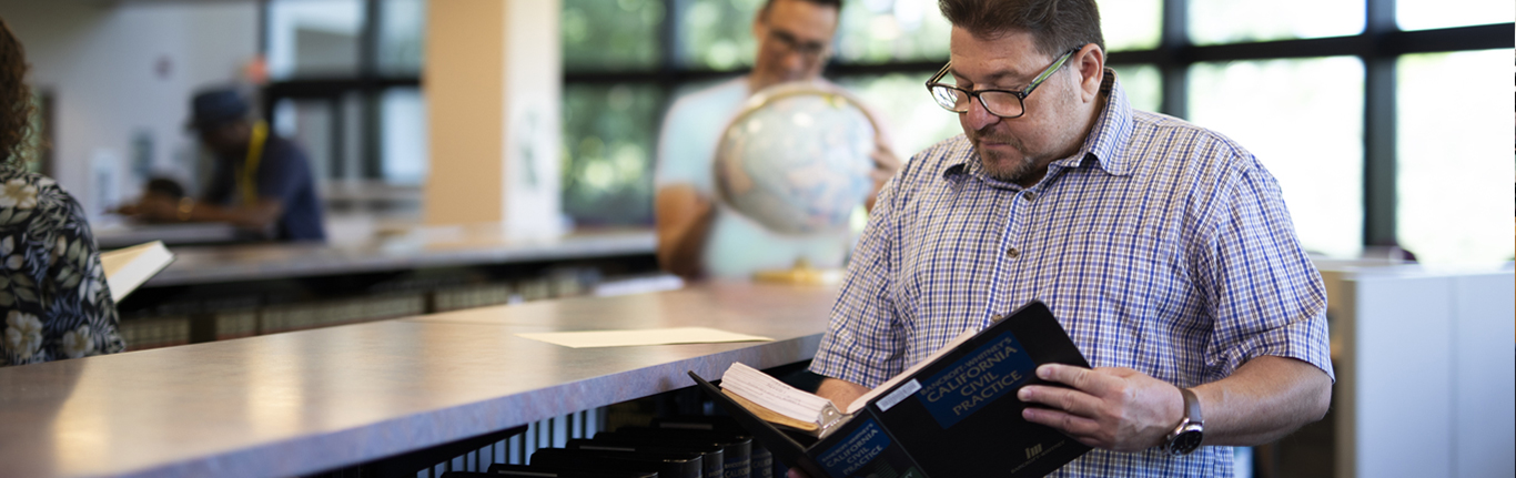 Library, man reading book