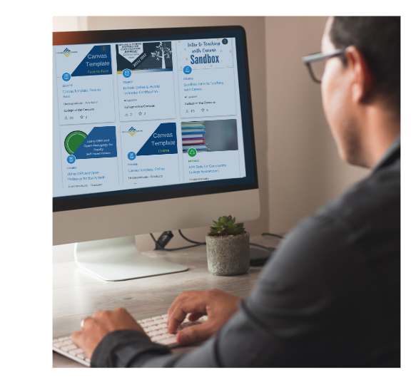 Man at a desktop computer looking through course templates in the Canvas Commons