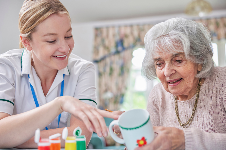OTA working with cheerful elderly woman.