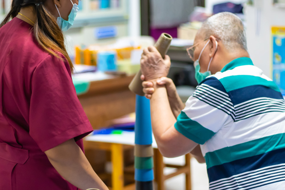 OTA helping elderly man.