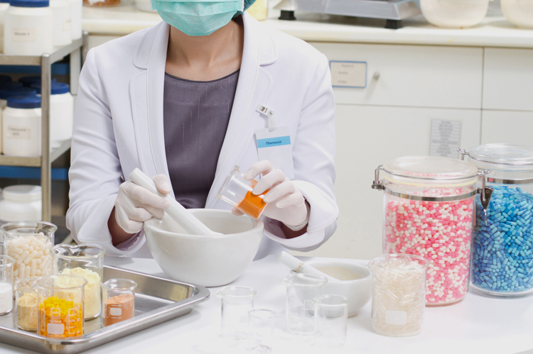 Pharmacy Technician arranging medications.