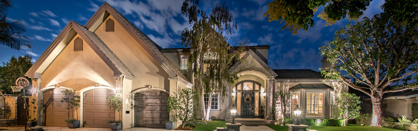 Beautifully lit home at twilight.