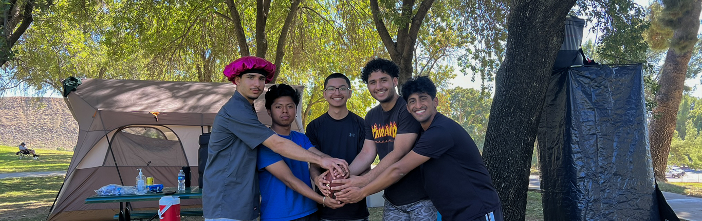 Students linking hands.