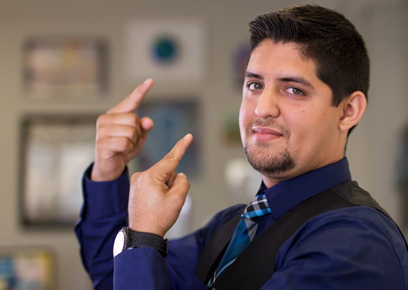 Student using sign language. 