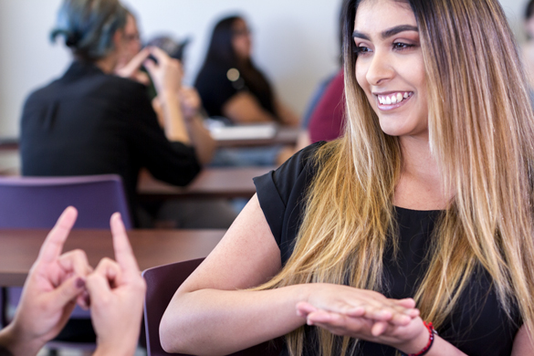 Students using sign language. 