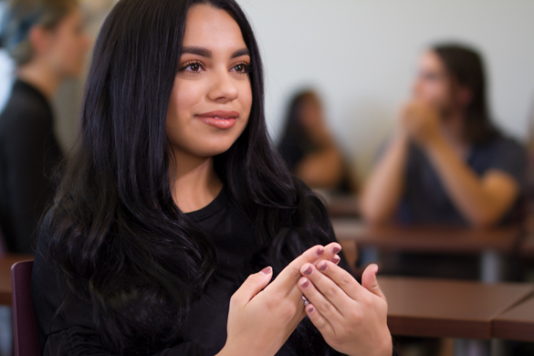 Student using sign language. 