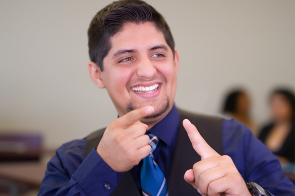 Student using sign language. 
