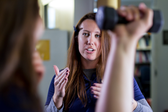 Sports Medicine student uses weights used for physical therapy. 