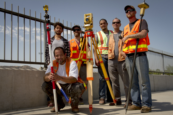 Members of CRC's team work on the Community Gardens' land surveying project.