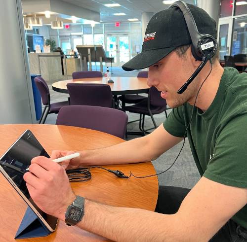 Tutor working with student online