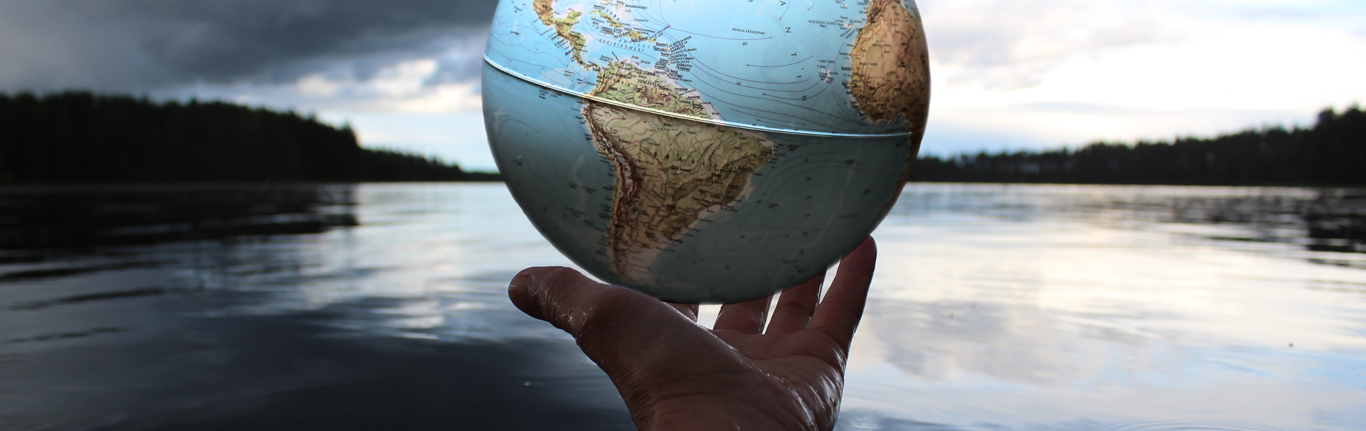 Water Systems Technolgy - Man holding globe.