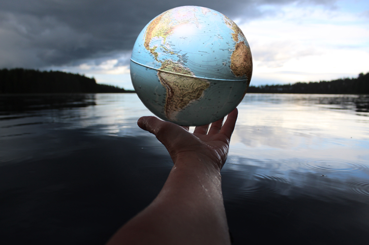Water Systems Technolgy - Man holding globe.