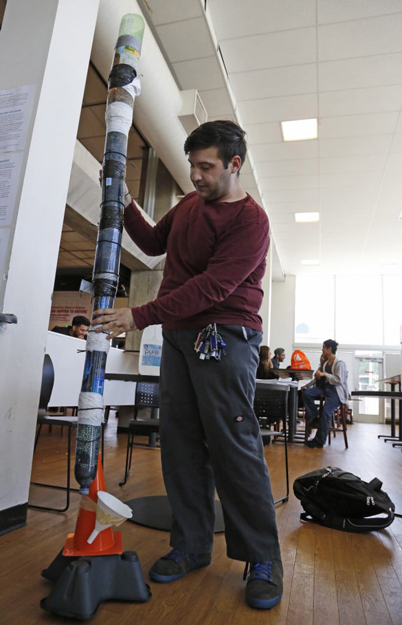 College of the Canyons student Anthony "Andrew" Tashjian explains how his water filtration system works in the cafeteria
