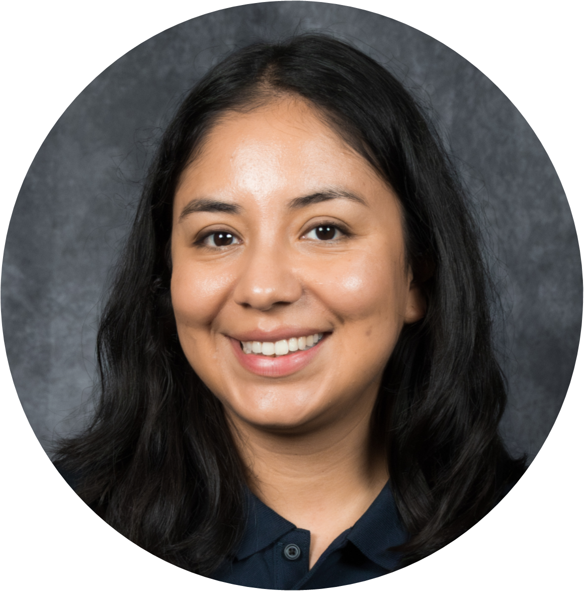 Headshot of a smiling woman with dark hair, set against a textured gray background.
