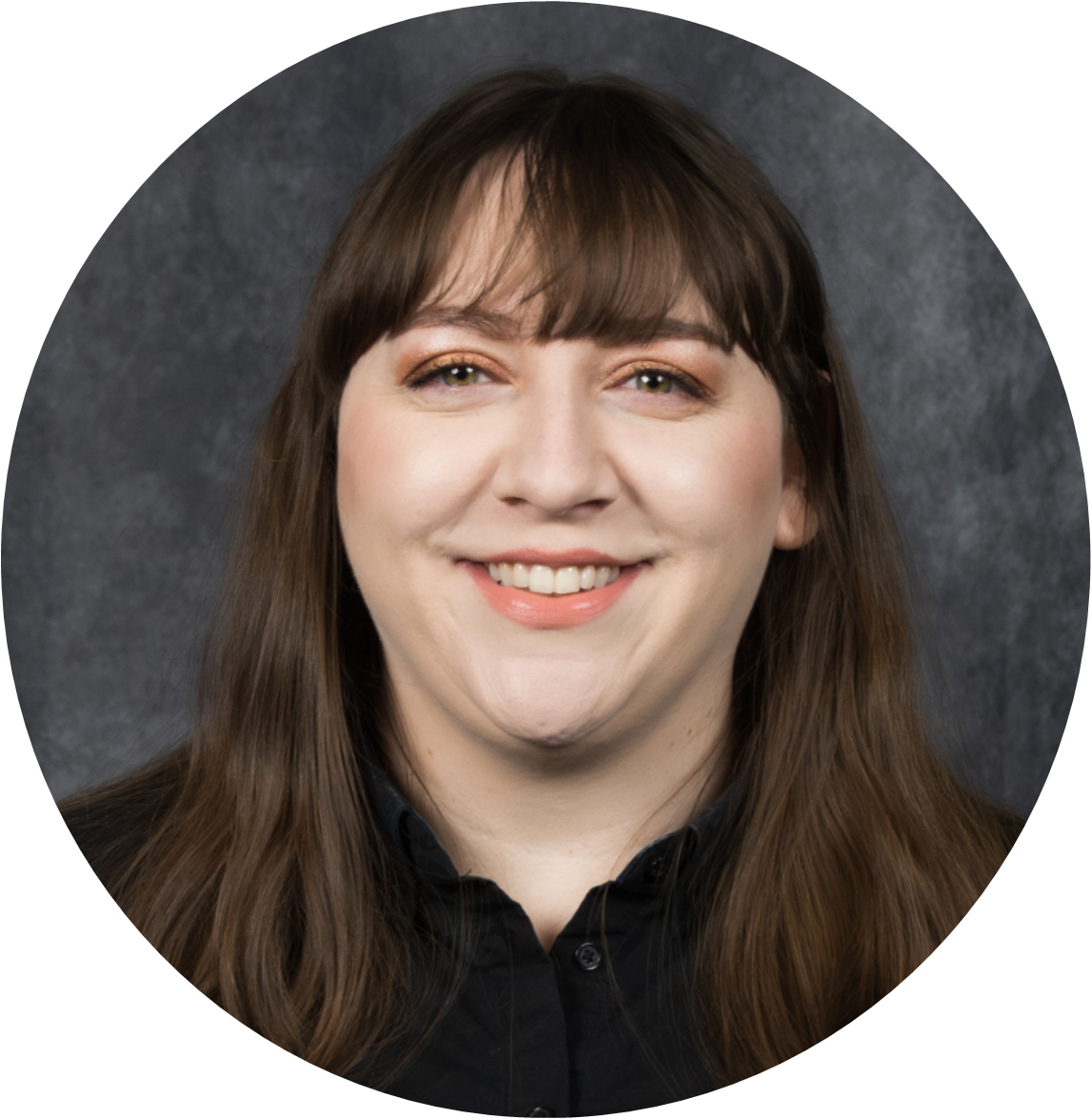 A professional headshot of a smiling woman with long brown hair, set against a textured gray background.