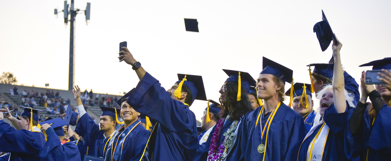 Graduating students participate in commencement.