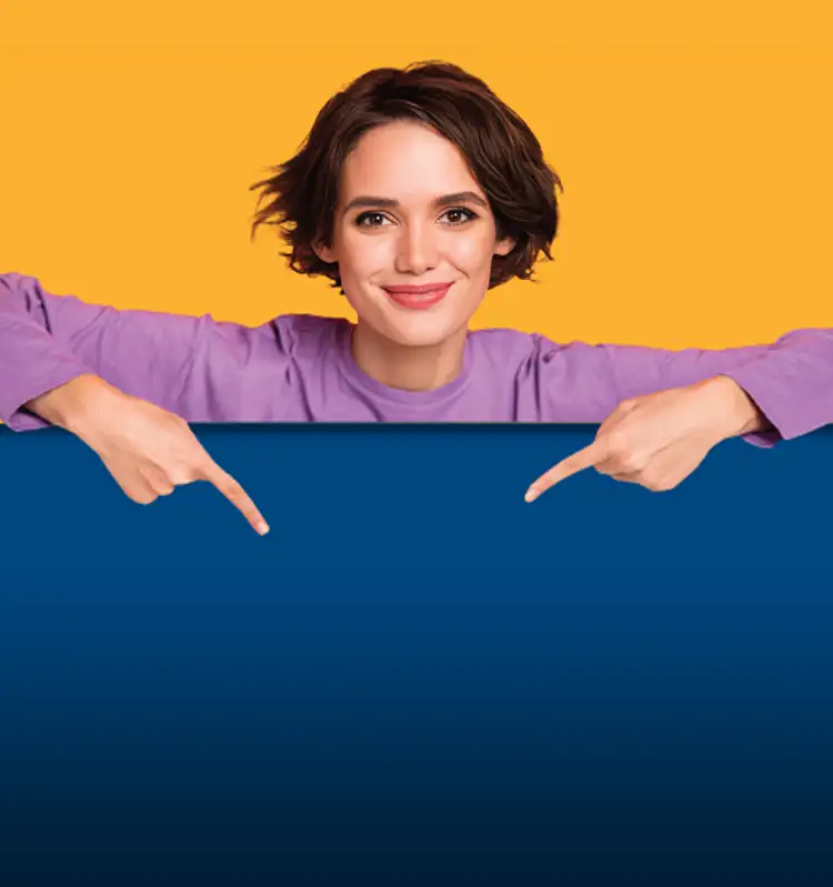 A female student smiles and points to the subject.