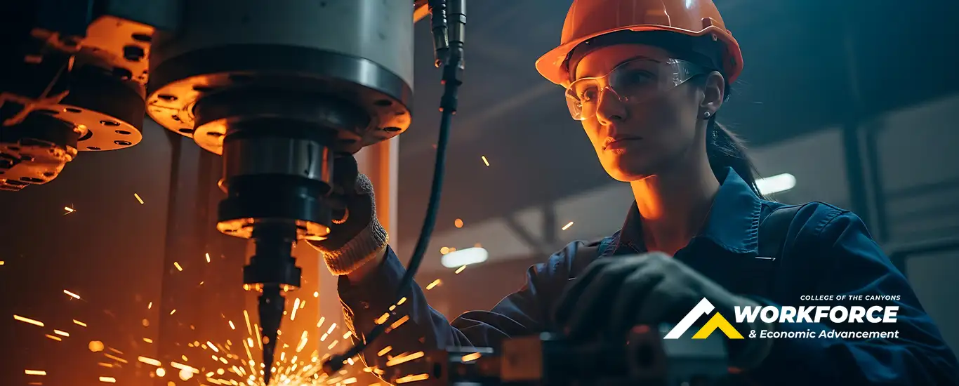 A woman performs manufacturing work. Image includes logo for Workforce and Economic Advancement