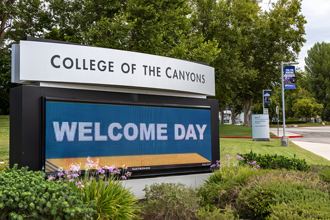 An outdoor marquee promotes Welcome Day to motorists on Rockwell Canyon Road.