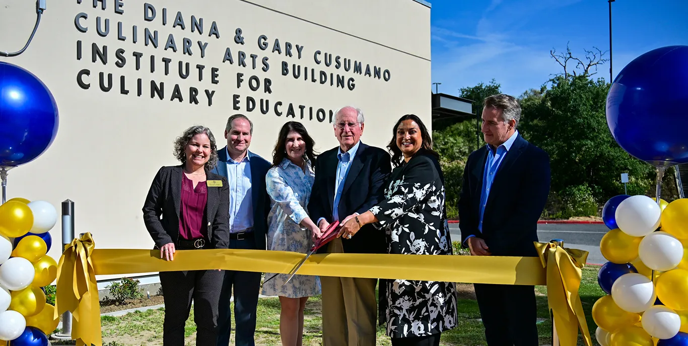 Gary Cusumano (center) is joined by family members and college officials for the ribbon-cutting of Cusumano ICuE on April 16, 2026.