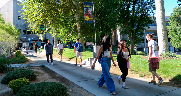 Students traverse a walkway at the Valencia campus.
