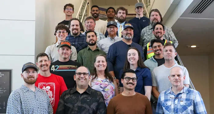 Land surveying alumni pose for a group photo.