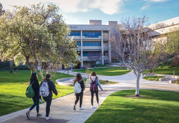 Students stroll in the Honor Grove at the Valencia campus.