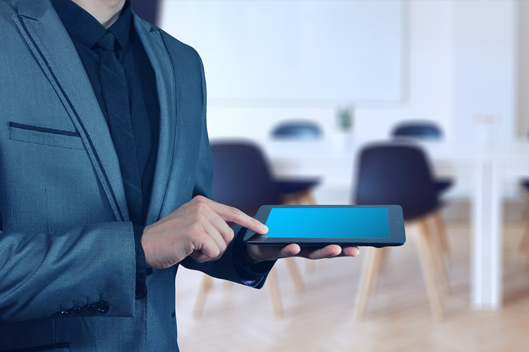 Male employer registration on laptop.