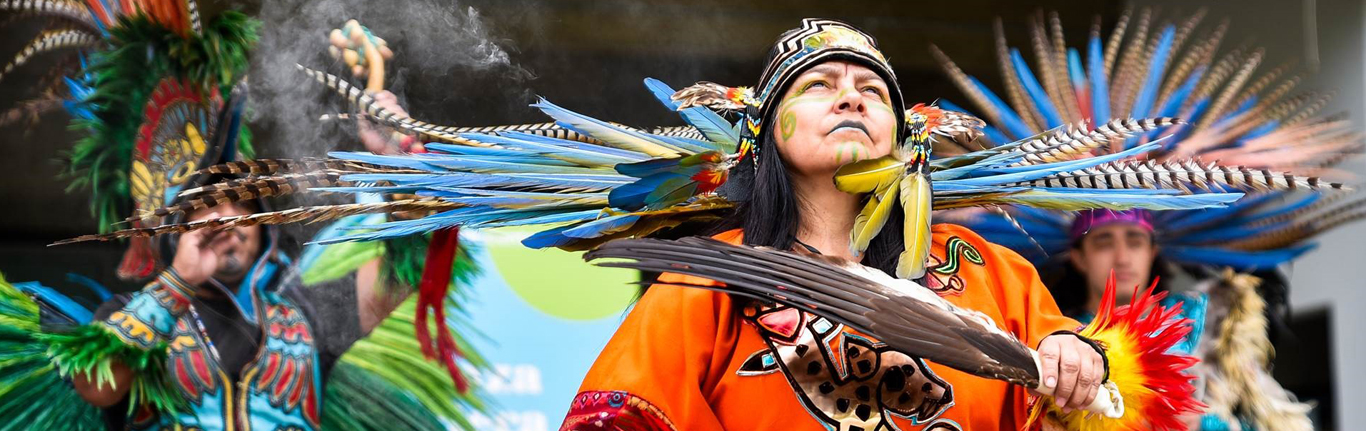 Tribal Indian Man dancing in cultural garments.