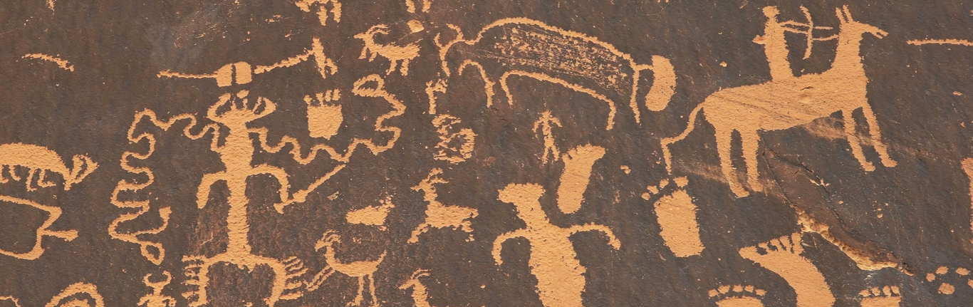 Shot of an American Indian art petroglyph of a hunting scene.