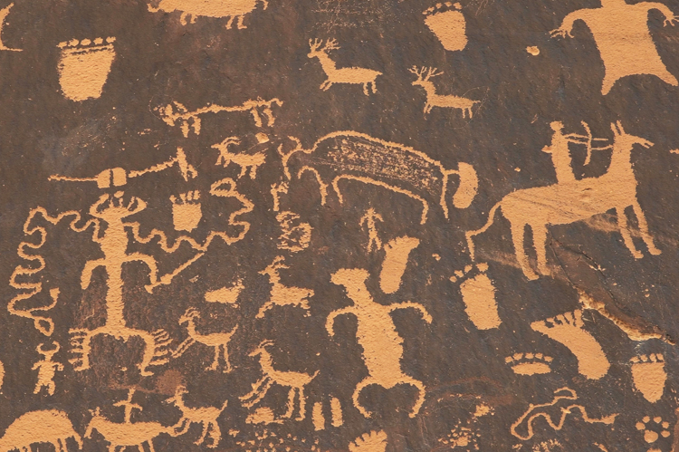 Shot of an American Indian art petroglyph of a hunting scene.