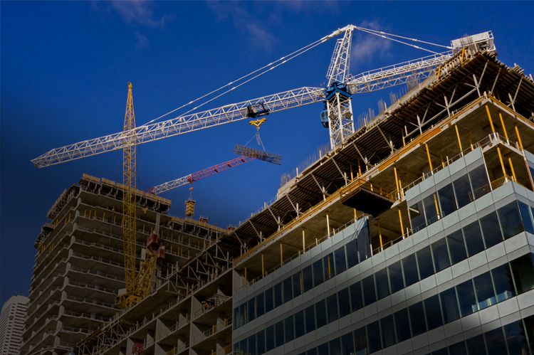 Construction site with high rise buildings and cranes.
