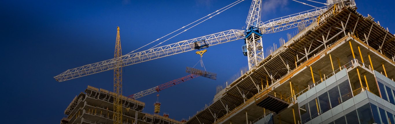 Construction site with high rise buildings and cranes.