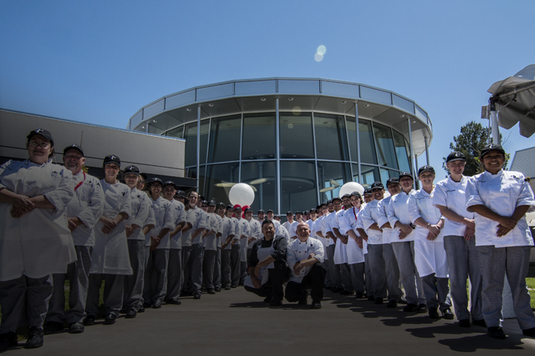 Two rows of iCUE culinary students, with faculty.